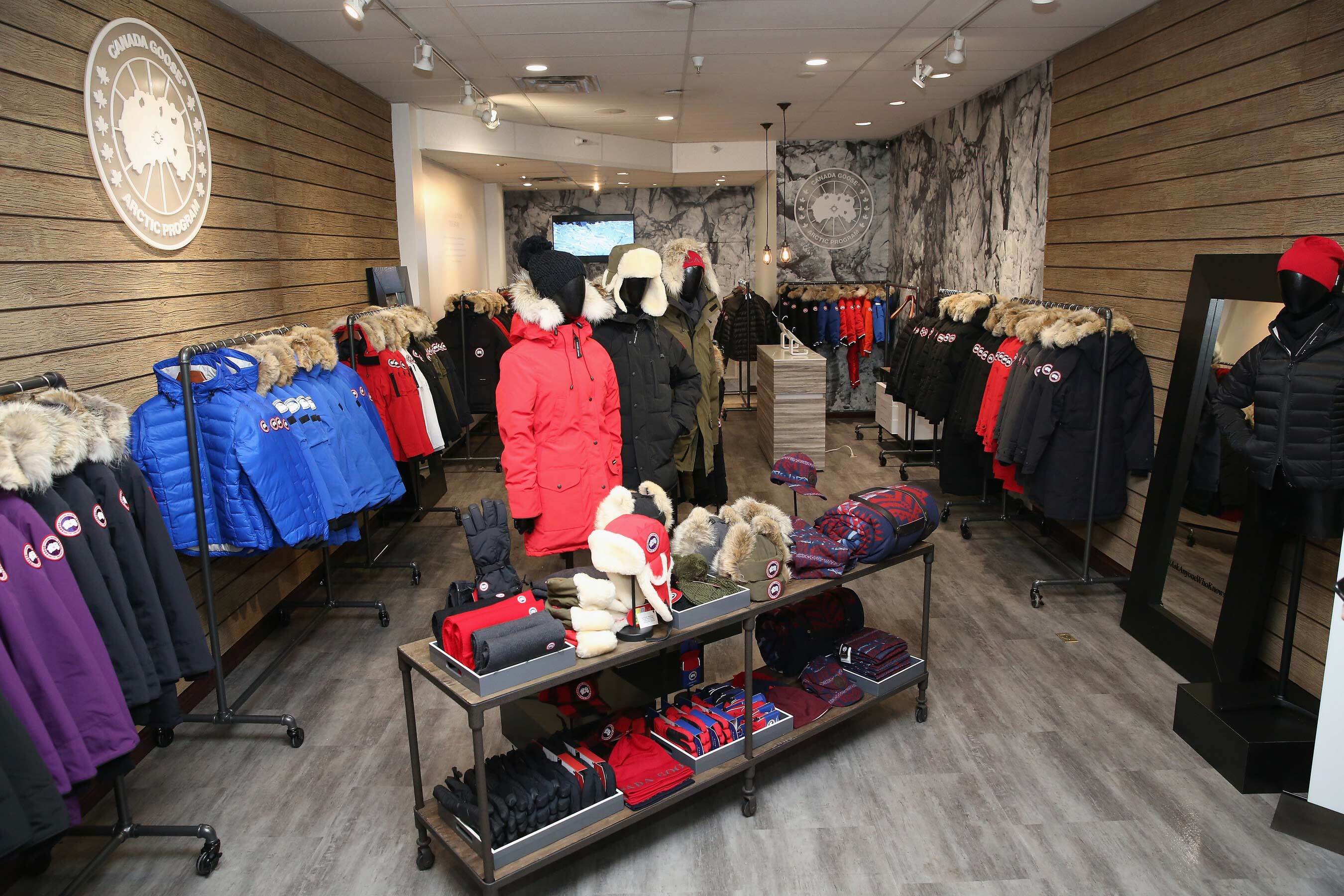 Interior of the Canada Goose pop-up shop at the 2016 Sundance Film Festival in Park City, with parkas on rails and the disc logo on the wall. Source: Canada Goose