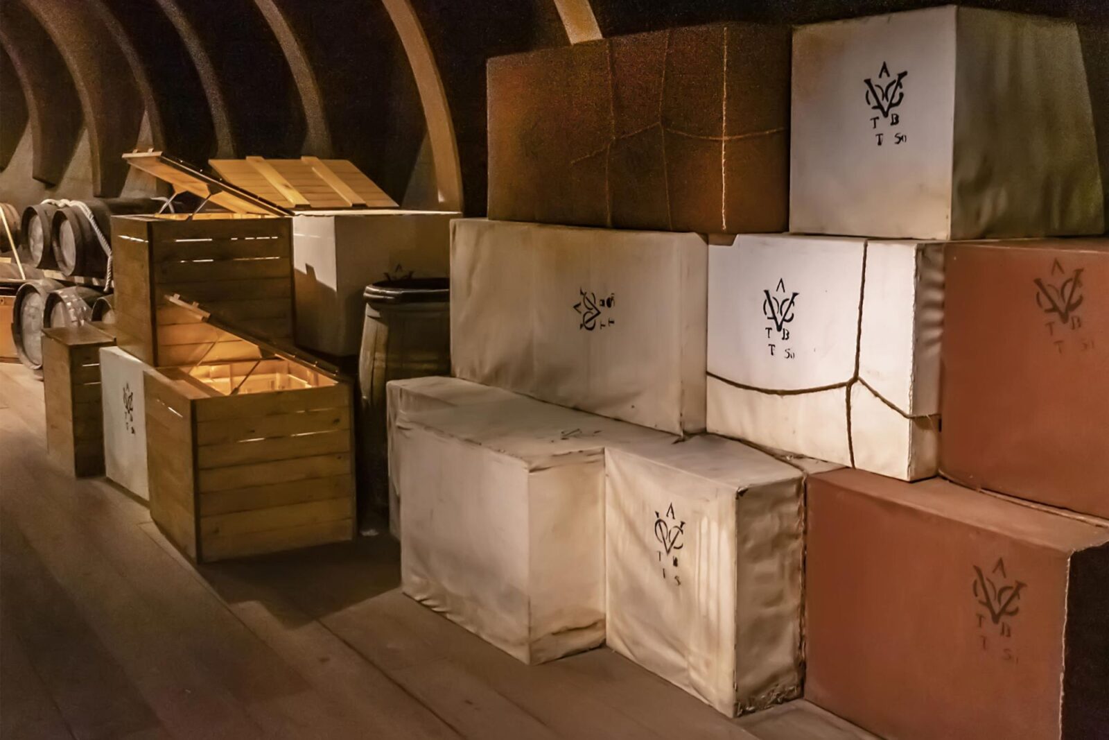 Stacked crates and bales in the hold of a ship, stamped with the VOC monogram of the Dutch East India Company.